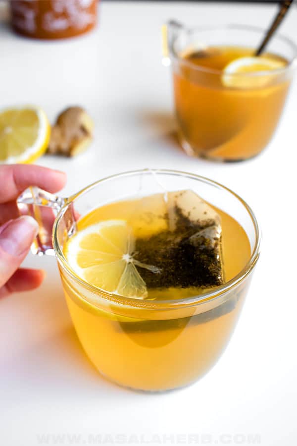 ginger tea with lemon, black tea and honey in a cup