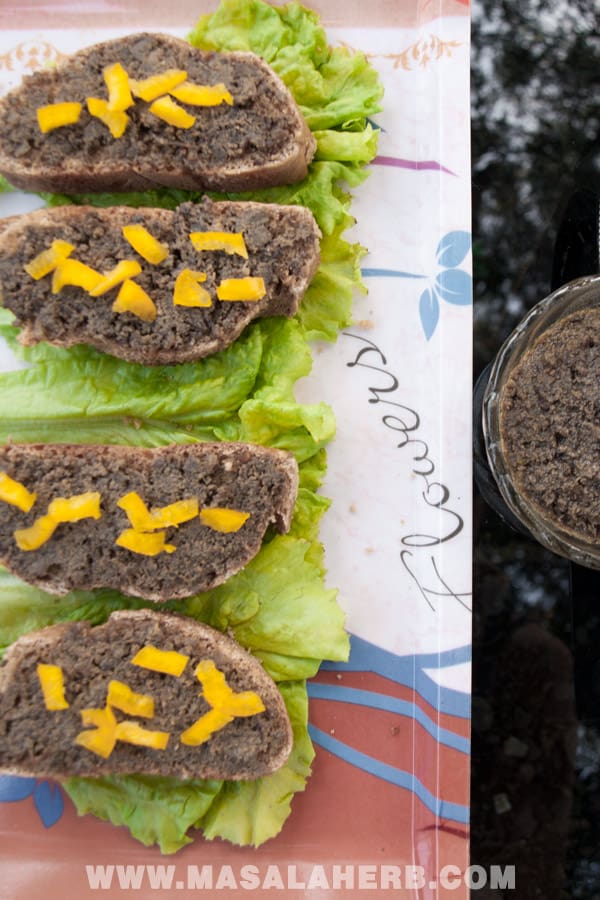 beef liver pate on bread slices topped with yellow bell pepper bird's eyes view