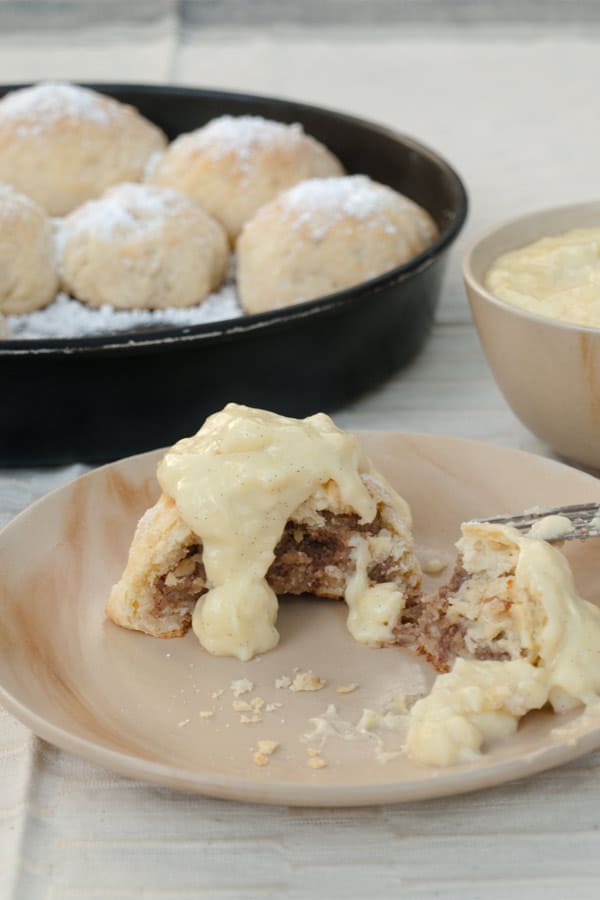 Buchteln stuffed with Hazelnut Paste and topped with Vanilla Sauce #stepbystep #recipe masalaherb.com