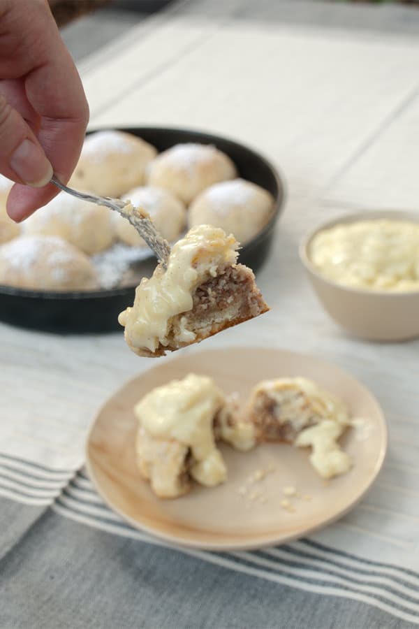 Buchteln stuffed with Hazelnut Paste and topped with Vanilla Sauce #stepbystep #recipe masalaherb.com