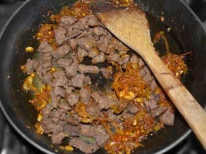 Goan Beef Chilli Fry Recipe - Quick & Easy Spicy Stir Fried Beef the Indian Goan Style with onion tomato garlic turmeric chili and vinegar. Easy to prepare because of the diced beef cubes which don't toughen that much while stir frying and because of the natural tenderizing agent. Read more here www.MasalaHerb.com #Recipe #Indiancuisine