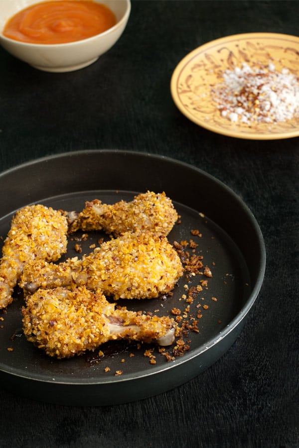 Golden Baked Chicken Drumsticks with Corn Flakes Coconut and Chili Flakes 