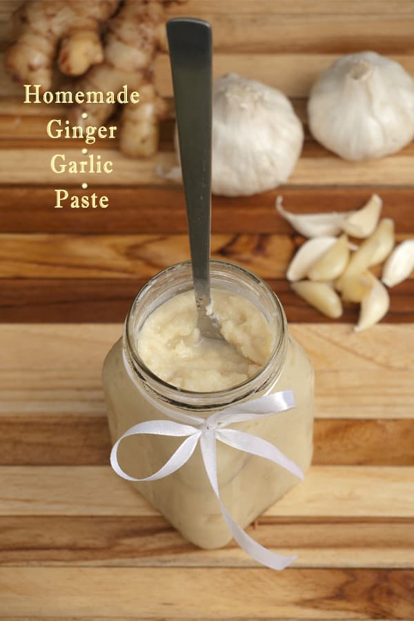 ginger and garlic turned into a paste and in a jar with a spoon
