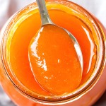 homemade apricot jam in a spoon