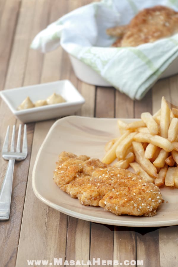 Sesame and breadcrumbs coated chicken schnitzel