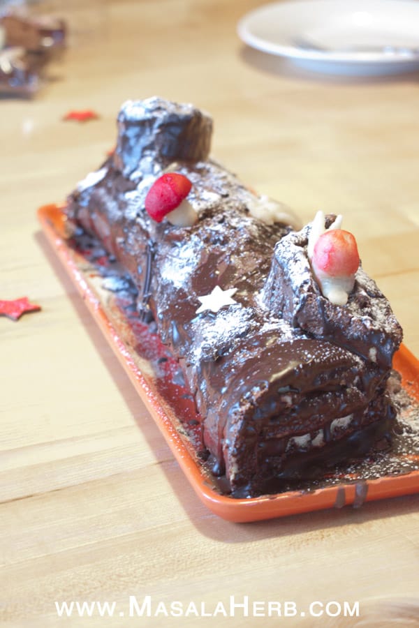 Easy Yule Log Recipe - Christmas Bûche de Noël Cake [French] with step by step picture tutorial to make the yule log easily at home. decorate the buche the noel to your liking with icing sugar and marzipan almond paste. This is our french family recipe! www.MasalaHerb.com #christmas #cake #yulelog #french