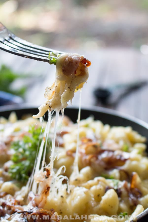 cheesy spaetzle noodles in a pan close up