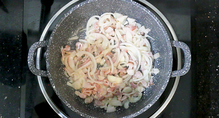 Cook pasta as per package instructions. Saute bacon and onion.