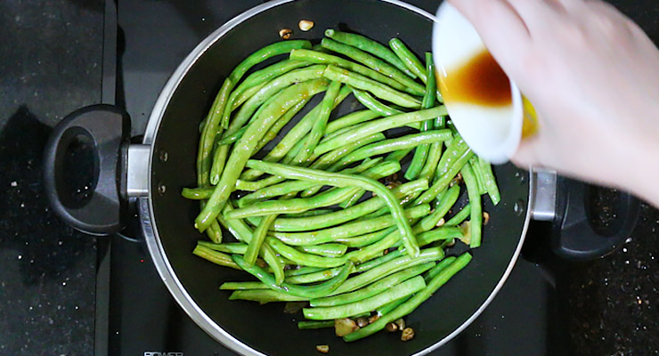 Pour stir-fry sauce over green beans and stir cook for another minute or two. 