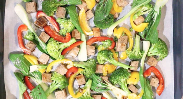 spread tofu and vegetables over sheet pan