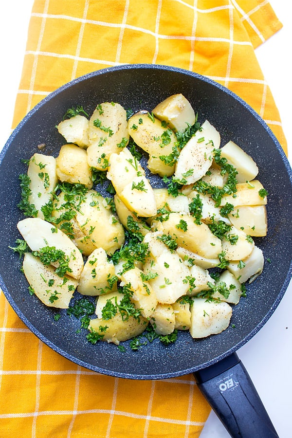 Butter Parsley Potatoes in a skillet