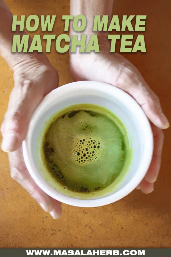 hands holding matcha tea in japanese cup