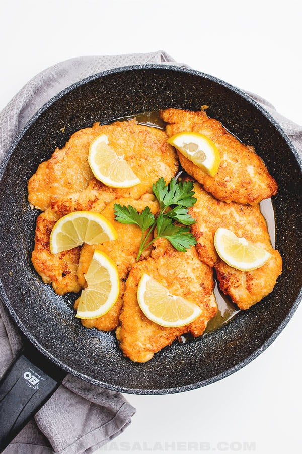 chicken piccata cutlets in a skillet bird's eye view