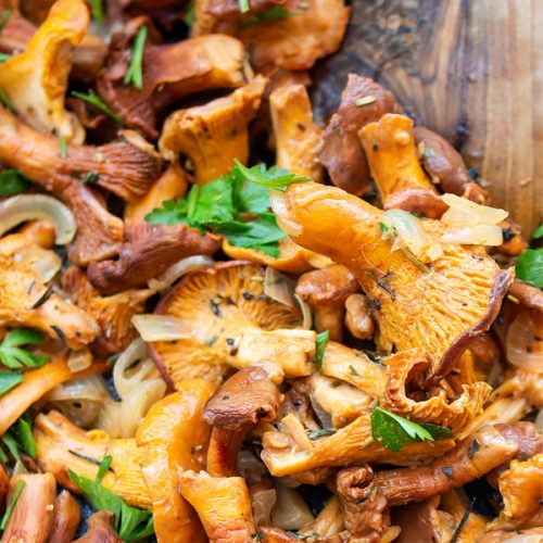 close uo chanterelle mushrooms in a pan