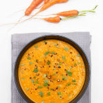 carrot ginger soup in a bowl bird's eyes view
