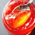 Quince Jelly in a spoon close up