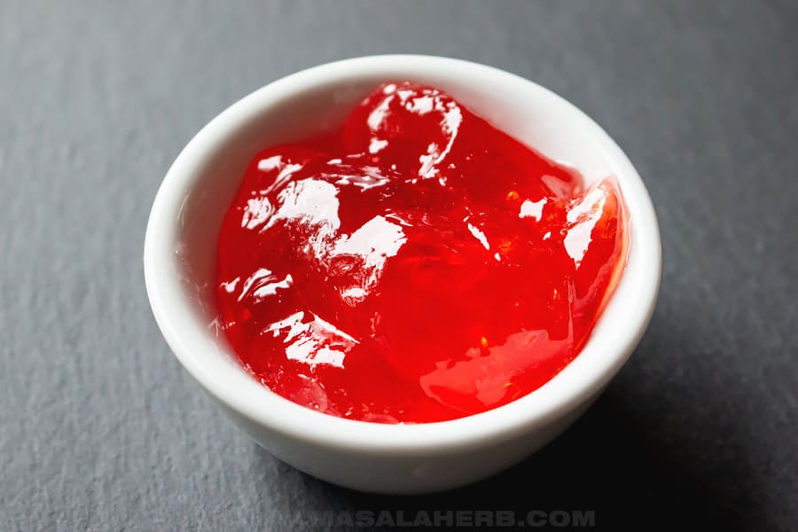 homemade quince jelly in a small container
