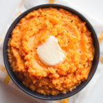 mashed sweet potato in a bowl with butter