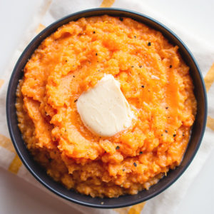 mashed sweet potato in a bowl with butter