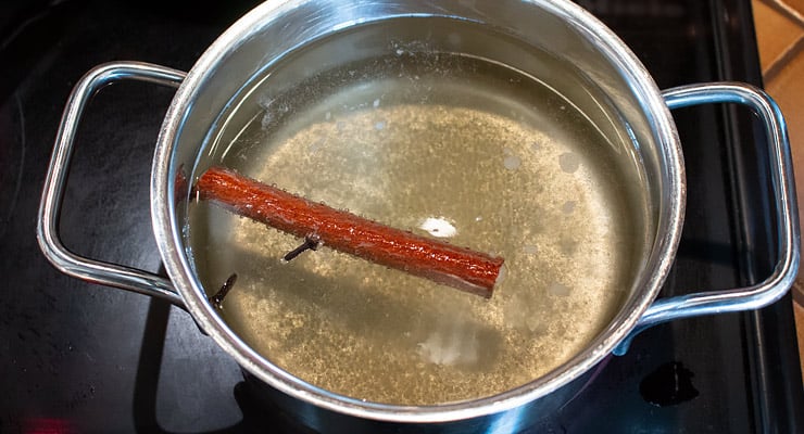 boil water with sugar and spices