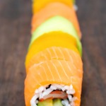cut rainbow sushi roll into slices
