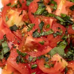 basil sprinkled over tomato salad