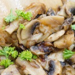 sauteed mushrooms in a skillet close up