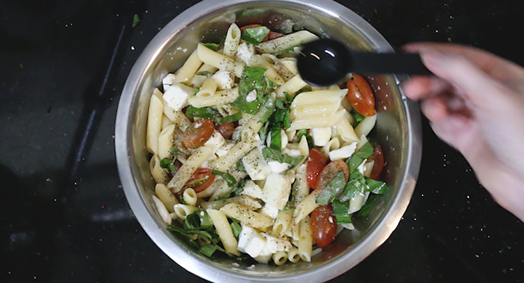 combine all ingredients in a bowl for the caprese pasta sald