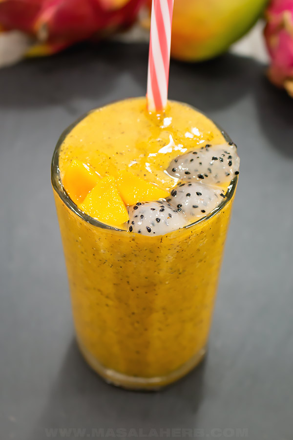 front view of dragon fruit smoothie with mango in glass