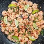 skillet shrimp with lie, butter, garlic, cilantro and crushed red chili pepper