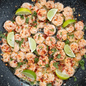skillet shrimp with lie, butter, garlic, cilantro and crushed red chili pepper