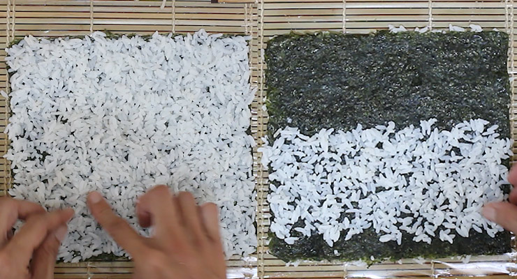 spread sushi rice over nori sheet on both sides