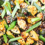 stir fried zucchini topped with sesame and chili flakes