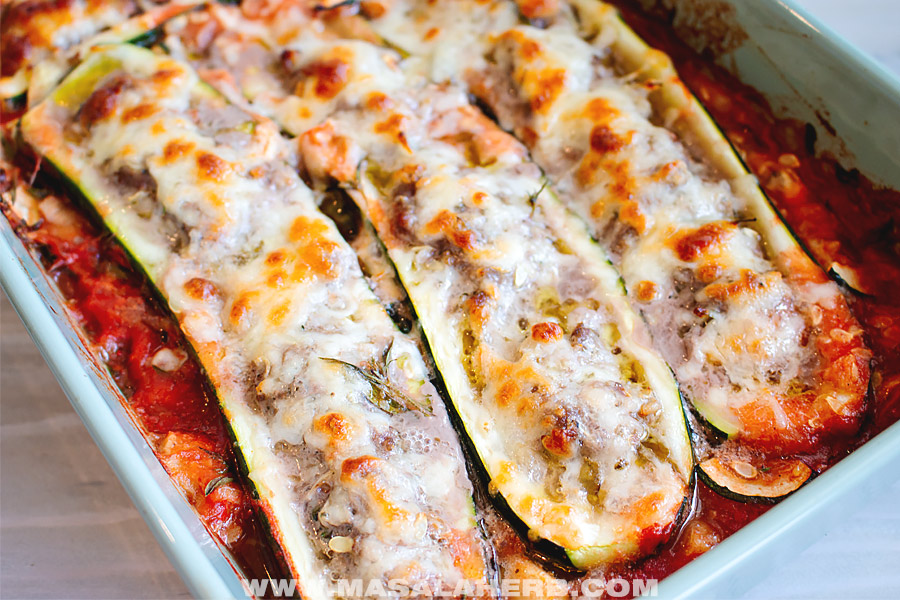 meat stuffed zucchini and cheese with a tomato sauce