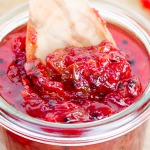 redcurrant fruit chutney with spices in a spoon and jar