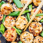 shrimp in a wok with chili flakes