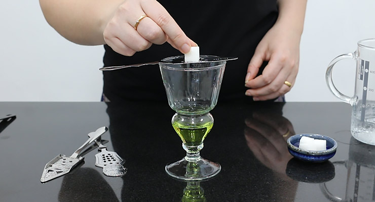 place sugar over absinthe spoon