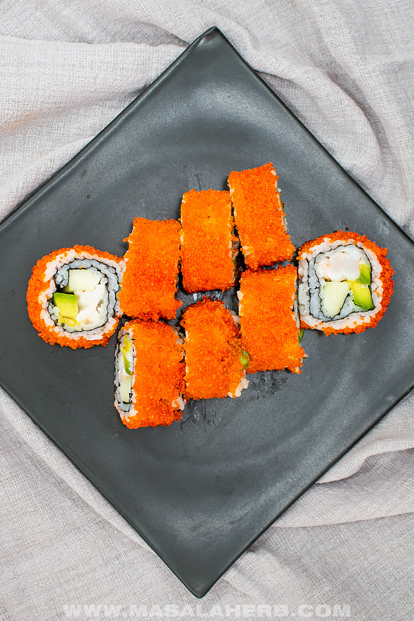 plated orange sushi roll