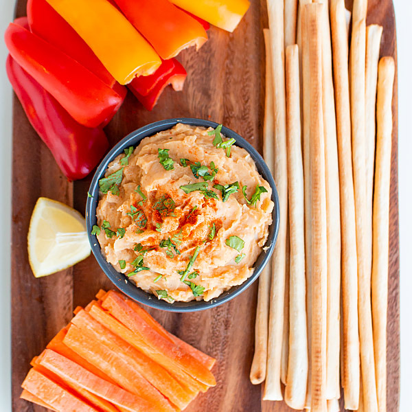 buffalo white bean dip with vegetable and grissini dippers