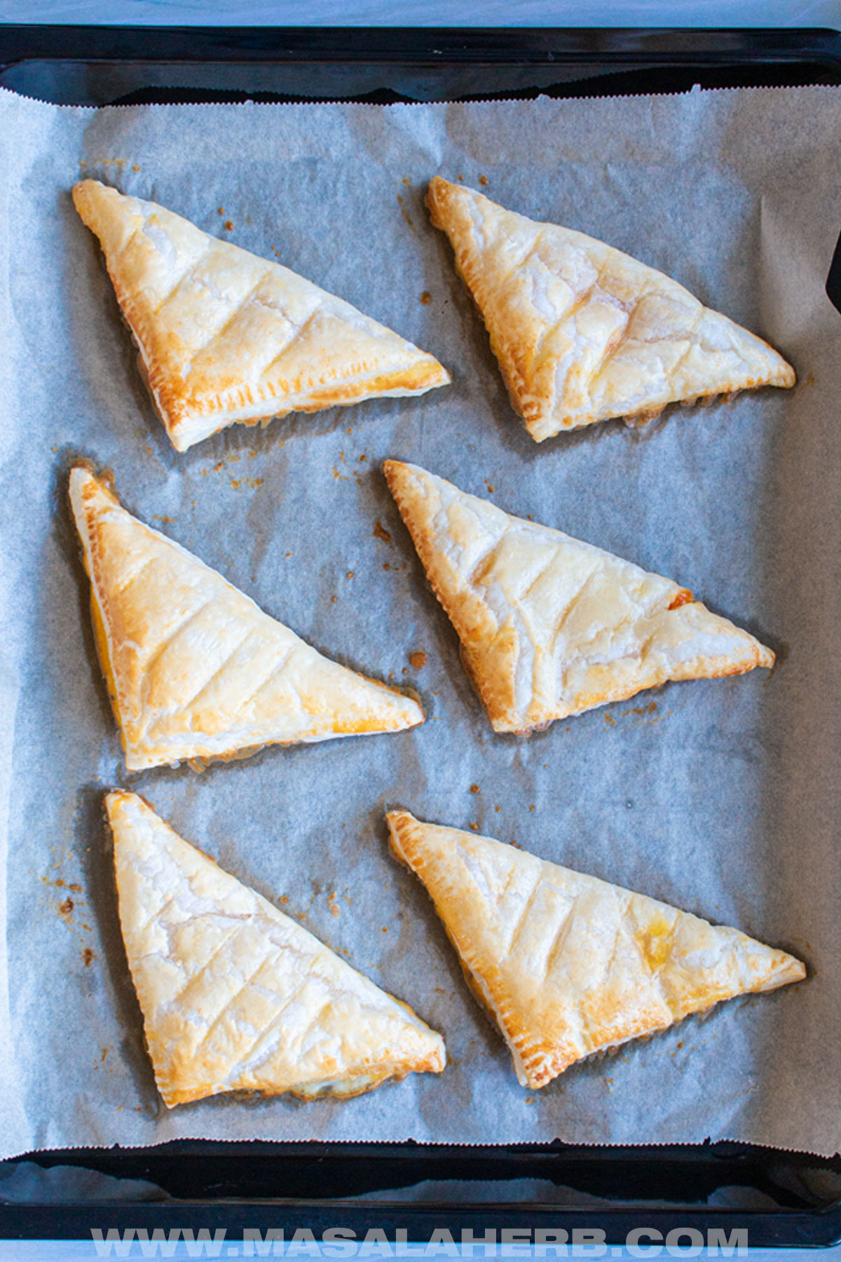 6 pastries filled with cream cheese and jam top down view