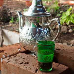 Moroccan Mint Tea with traditional glass and kettle