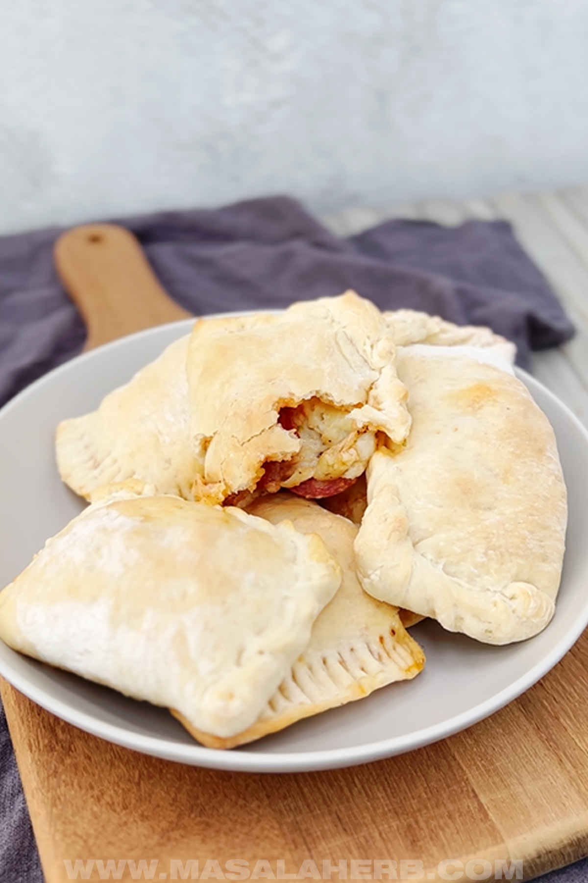 Pizza pockets with pepperoni cheese filling oozing out