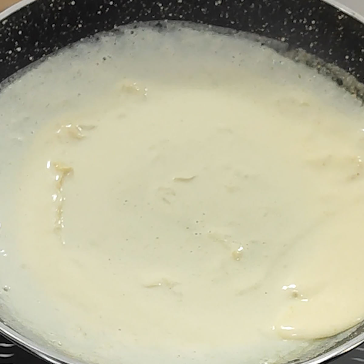 move around the skillet to spread the crepe batter