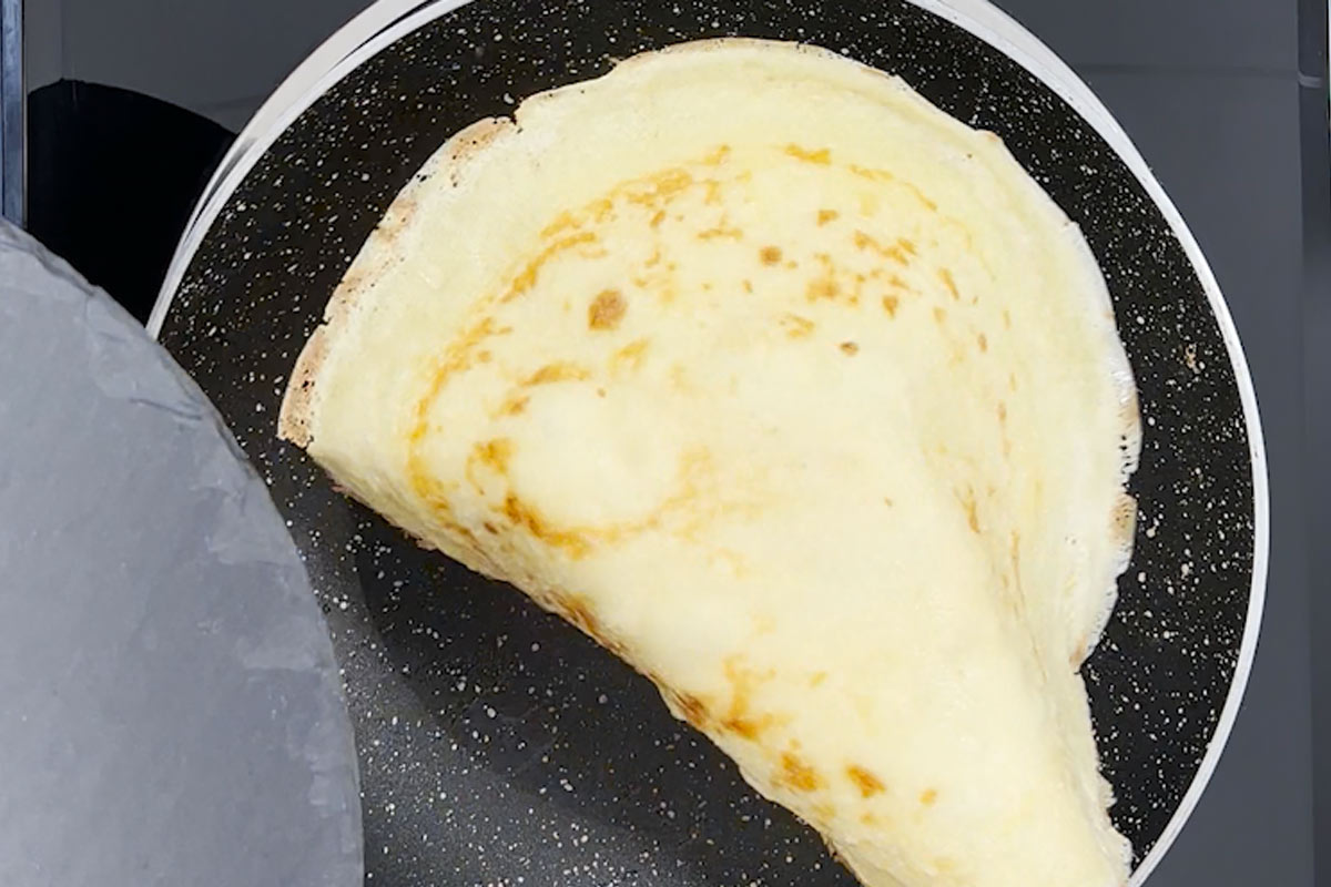 stack cooked crepes on a plate