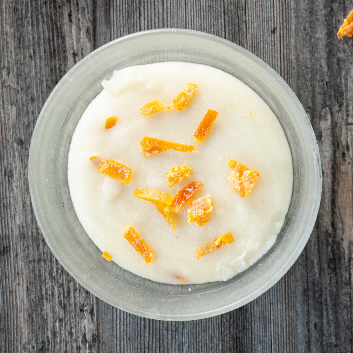 Semolina Pudding with Orange in a bowl top down view