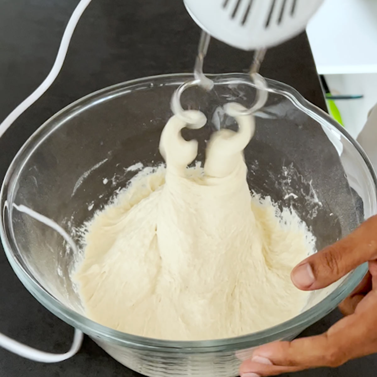 mix and beat baguette dough with a mixer dough hook