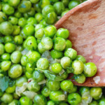 close up cooked buttered green peas