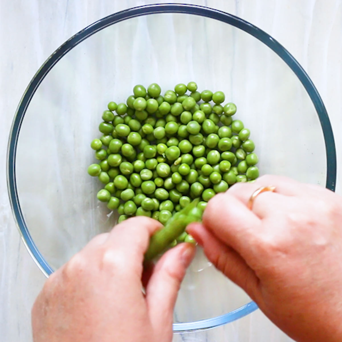 shelling green peas