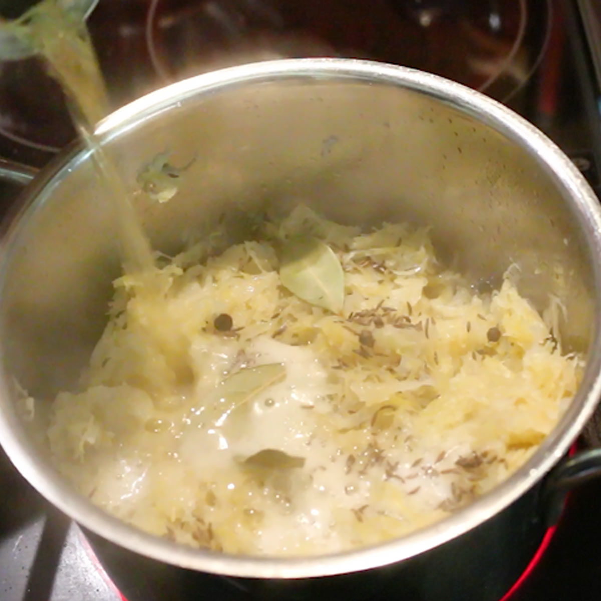 pour beer into sauerkraut