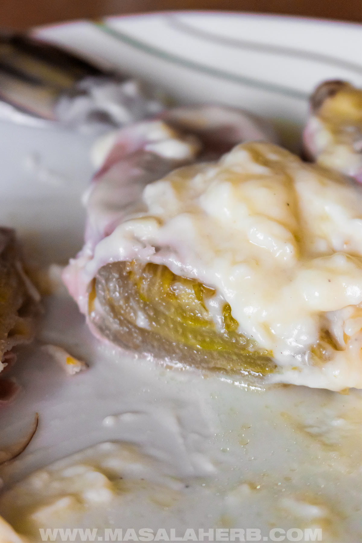cooked endive with ham and béchamel cheese sauce